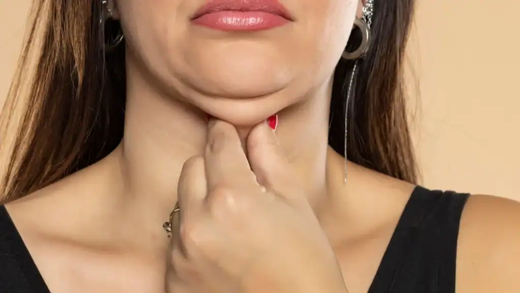 An image of a woman with double chin, sad, worried : Non Surgical Double Chin Removal Treatment in Rutherglen, UK