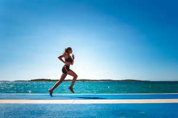 Woman running showing strong leg muscle Rutherglen
